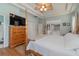 Bright bedroom with a queen-size bed and built-in wardrobe at 6689 Bell Glade Pl, Sanford, FL 32771