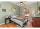 Cozy bedroom with a double bed and charming decor at 6689 Bell Glade Pl, Sanford, FL 32771