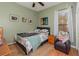 Well-lit bedroom with a comfy bed and an armchair at 6689 Bell Glade Pl, Sanford, FL 32771