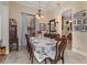 Elegant dining room with a large table, formal chairs, and decorative accents at 6689 Bell Glade Pl, Sanford, FL 32771
