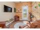 Home gym with wood walls, flooring, and exercise equipment at 6689 Bell Glade Pl, Sanford, FL 32771