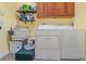 Laundry room with washer, dryer and utility sink at 6689 Bell Glade Pl, Sanford, FL 32771