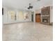 Spacious living room featuring a brick fireplace and large windows with plantation shutters at 6689 Bell Glade Pl, Sanford, FL 32771