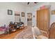Bright office with built-in wooden cabinet and hardwood floor at 6689 Bell Glade Pl, Sanford, FL 32771