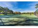 A green tennis court offers a recreational space for residents to enjoy, promoting an active and social lifestyle at 7321 Brightland St, Windermere, FL 34786