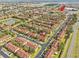 Bird's eye view of residential area with numerous townhomes, streets and nearby amenities at 100 Palermo St, Davenport, FL 33897