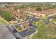 Aerial view of the residential community entrance, buildings, and landscaping at 100 Palermo St, Davenport, FL 33897