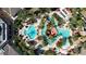 Resort-style pool with lazy river and surrounding landscape at 100 Palermo St, Davenport, FL 33897