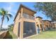 Private screened patio and balcony with grassy yard at 100 Palermo St, Davenport, FL 33897