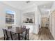 Dining area looking into the kitchen; bright and open floorplan at 100 Palermo St, Davenport, FL 33897