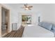 Bright main bedroom with light walls, light floors, and ceiling fan at 100 Palermo St, Davenport, FL 33897