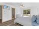 Bright main bedroom with light walls, light floors, and ceiling fan at 100 Palermo St, Davenport, FL 33897
