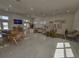 Well-lit lounge with neutral decor, modern furniture, and tile flooring at 1210 Southstation Pl # 303, Orlando, FL 32809