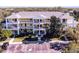 Three story condo building with mature landscaping and ample parking at 411 Lucaya Loop # 411, Davenport, FL 33897