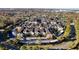 Aerial view of a large apartment community with ample parking and landscaping at 5316 Pebble Beach Dr # E, Orlando, FL 32811