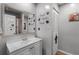 Simple bathroom with white vanity and relaxing wall decor at 5316 Pebble Beach Dr # E, Orlando, FL 32811