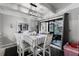 Dining area with white table and chairs near kitchen at 5316 Pebble Beach Dr # E, Orlando, FL 32811