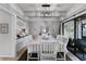 Open dining room featuring a white table with seating for six and stylish decor accents at 5316 Pebble Beach Dr # E, Orlando, FL 32811