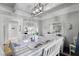 Dining room features white table and chairs, kitchen view at 5316 Pebble Beach Dr # E, Orlando, FL 32811