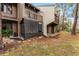 Back exterior showcasing private patio and surrounding landscape at 5316 Pebble Beach Dr # E, Orlando, FL 32811