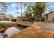 Exterior view showing building and a wooden footbridge over a canal at 5316 Pebble Beach Dr # E, Orlando, FL 32811