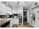 Updated kitchen boasting white cabinets, stainless steel appliances, and a breakfast bar at 5316 Pebble Beach Dr # E, Orlando, FL 32811
