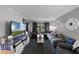 Spacious living room featuring a comfy sectional sofa and large TV at 5316 Pebble Beach Dr # E, Orlando, FL 32811