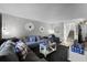 Cozy living room with plush seating, patterned throw pillows, and staircase access to upper levels at 5316 Pebble Beach Dr # E, Orlando, FL 32811