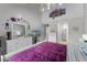 Main bedroom with a king-size bed, dresser, and access to another room at 5316 Pebble Beach Dr # E, Orlando, FL 32811