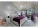 Spacious main bedroom with a vaulted ceiling and private balcony access at 5316 Pebble Beach Dr # E, Orlando, FL 32811