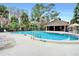 Relaxing kidney-shaped pool with lounge chairs at 5316 Pebble Beach Dr # E, Orlando, FL 32811