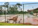 Community tennis courts with chain-link fence at 5316 Pebble Beach Dr # E, Orlando, FL 32811