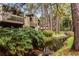 Peaceful waterway view with lush foliage and wooded surroundings at 5316 Pebble Beach Dr # E, Orlando, FL 32811