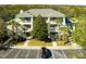 Condo exterior showcasing multiple units with private balconies and lush landscaping at 608 Gran Bahama Blvd # 608, Davenport, FL 33897