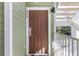Inviting condo front door with olive green siding and white trim offers a warm welcome at 608 Gran Bahama Blvd # 608, Davenport, FL 33897