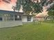 Backyard featuring patio and lush green grass at 1048 Wakefield Cir, Deltona, FL 32725
