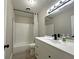 Bathroom featuring subway tile surround, modern vanity, and updated fixtures at 1048 Wakefield Cir, Deltona, FL 32725