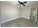 Bedroom with wood look floors and a ceiling fan at 1048 Wakefield Cir, Deltona, FL 32725
