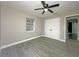 Bedroom with wood floors, closet, and neutral walls at 1048 Wakefield Cir, Deltona, FL 32725