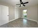 Bedroom with wood look floors and closet at 1048 Wakefield Cir, Deltona, FL 32725