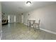 Dining area offers tile flooring and a view of the front entry and living room at 1048 Wakefield Cir, Deltona, FL 32725
