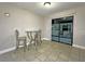 Cozy dining area featuring tile floors and sliding glass doors to the lanai at 1048 Wakefield Cir, Deltona, FL 32725