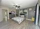 Spacious main bedroom with modern decor, ceiling fan, and stylish bedding at 1048 Wakefield Cir, Deltona, FL 32725