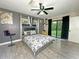 Comfortable main bedroom with ceiling fan, natural light, and closet access at 1048 Wakefield Cir, Deltona, FL 32725