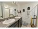 Modern bathroom with double sinks and walk-in shower at 4815 Rigging St, Haines City, FL 33844