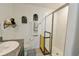 Clean bathroom with double sinks, walk-in shower, and gray vanity at 4815 Rigging St, Haines City, FL 33844