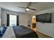 Main bedroom with large TV and en-suite bathroom at 4815 Rigging St, Haines City, FL 33844