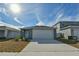 Two-car garage and freshly paved driveway in front of the house at 4815 Rigging St, Haines City, FL 33844