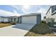 Single-car garage with driveway and landscaping at 4815 Rigging St, Haines City, FL 33844