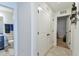 Hallway with double doors and bathroom access at 4815 Rigging St, Haines City, FL 33844